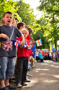 Sheffield Olympic Torch Relay 2012 Children lined up with union Jack flags in Hillsborough Park, waiting for the Torch…