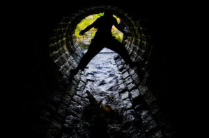 Through the tunnel.