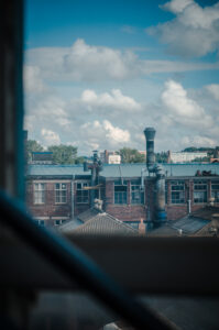 Across the rooftops.