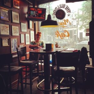Rebekah securing the best table in #thebulldog's #cafemack. An awesome smoker-friendly bar in the #redlightdistrict