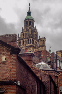 Brick Mountain Red brick buildings obscuring Sheffield Town Hall.