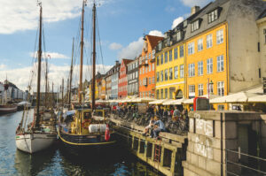 Nyhavn, Copenhagen Nyhavn (Danish pronunciation: [ˈnyhɑʊ̯ˀn]) (literally: New Harbour) is a 17th-century waterfront, ca…